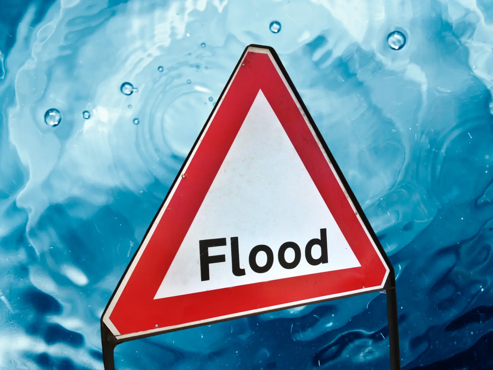 Flood Sign Red Triangle with water background