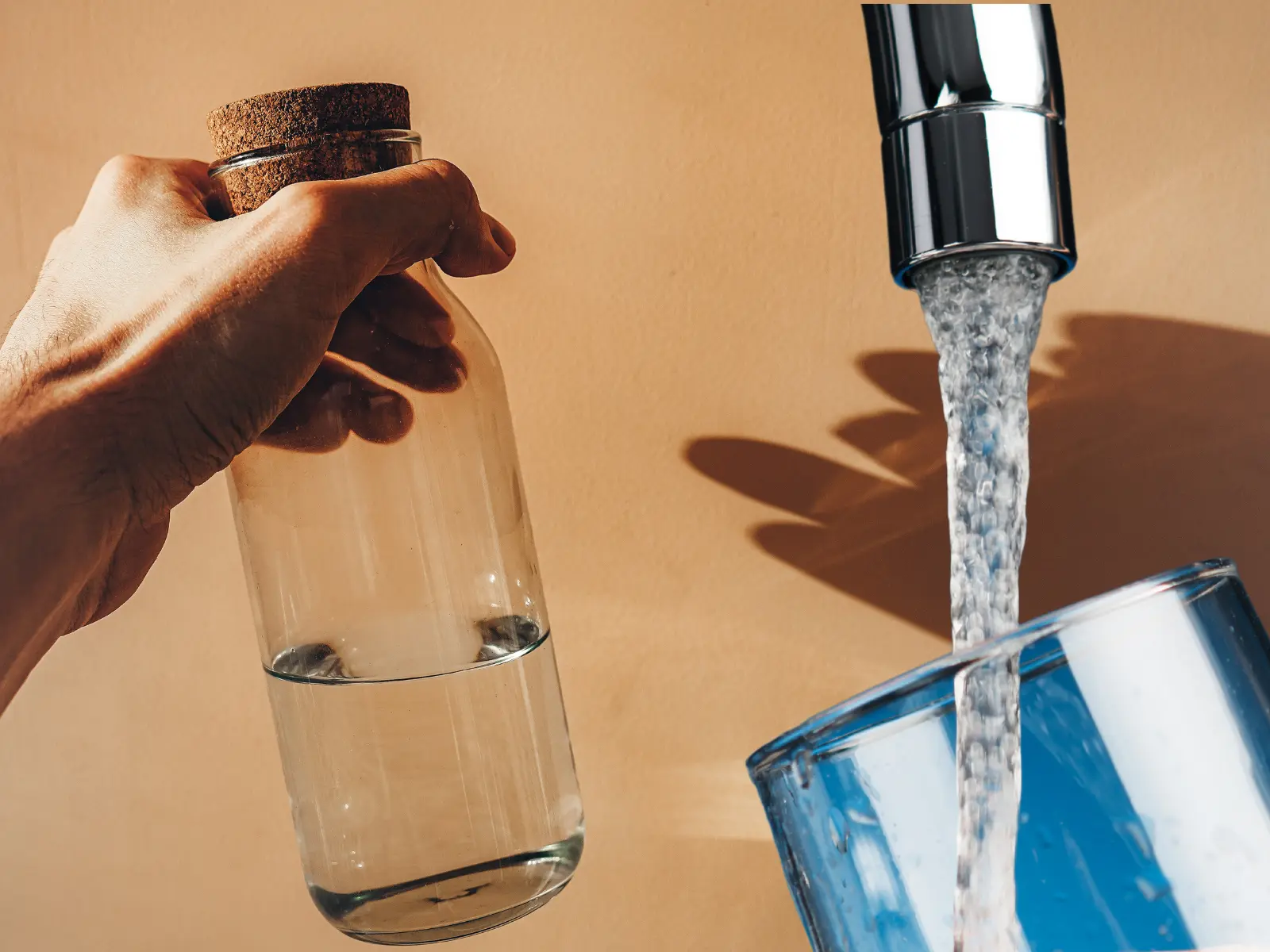 water pitchers and a faucet pouring water into a glass